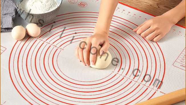 Non-stick silicone mat used for rolling dough in home kitchen